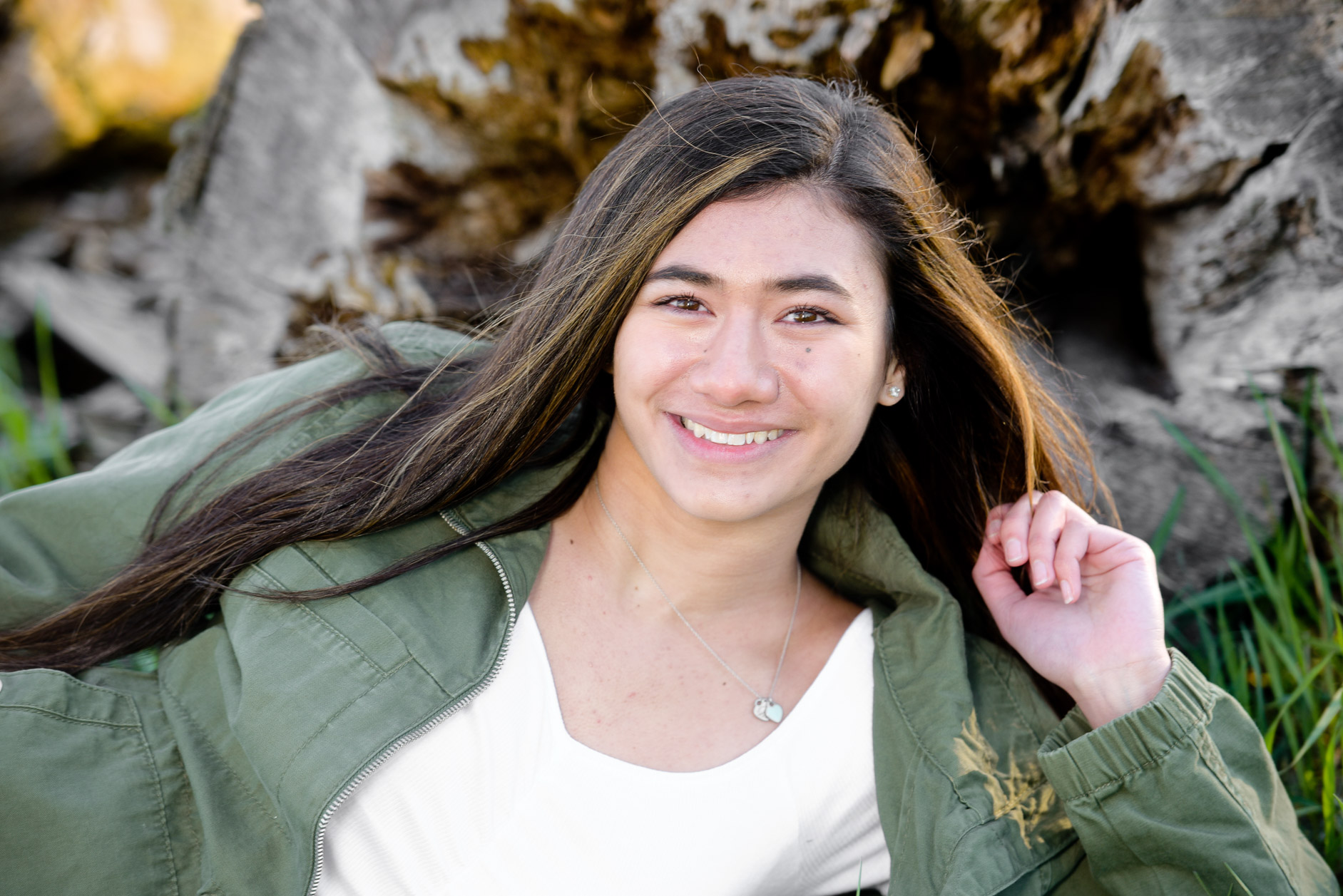 Troy, Michigan senior photographer's photo of the high school senior as her hair blows wildly during her photography session in Troy Michigan.