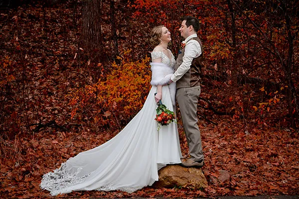 Couple in the fall at their Waldenwoods Wedding in Hartland, Michigan.