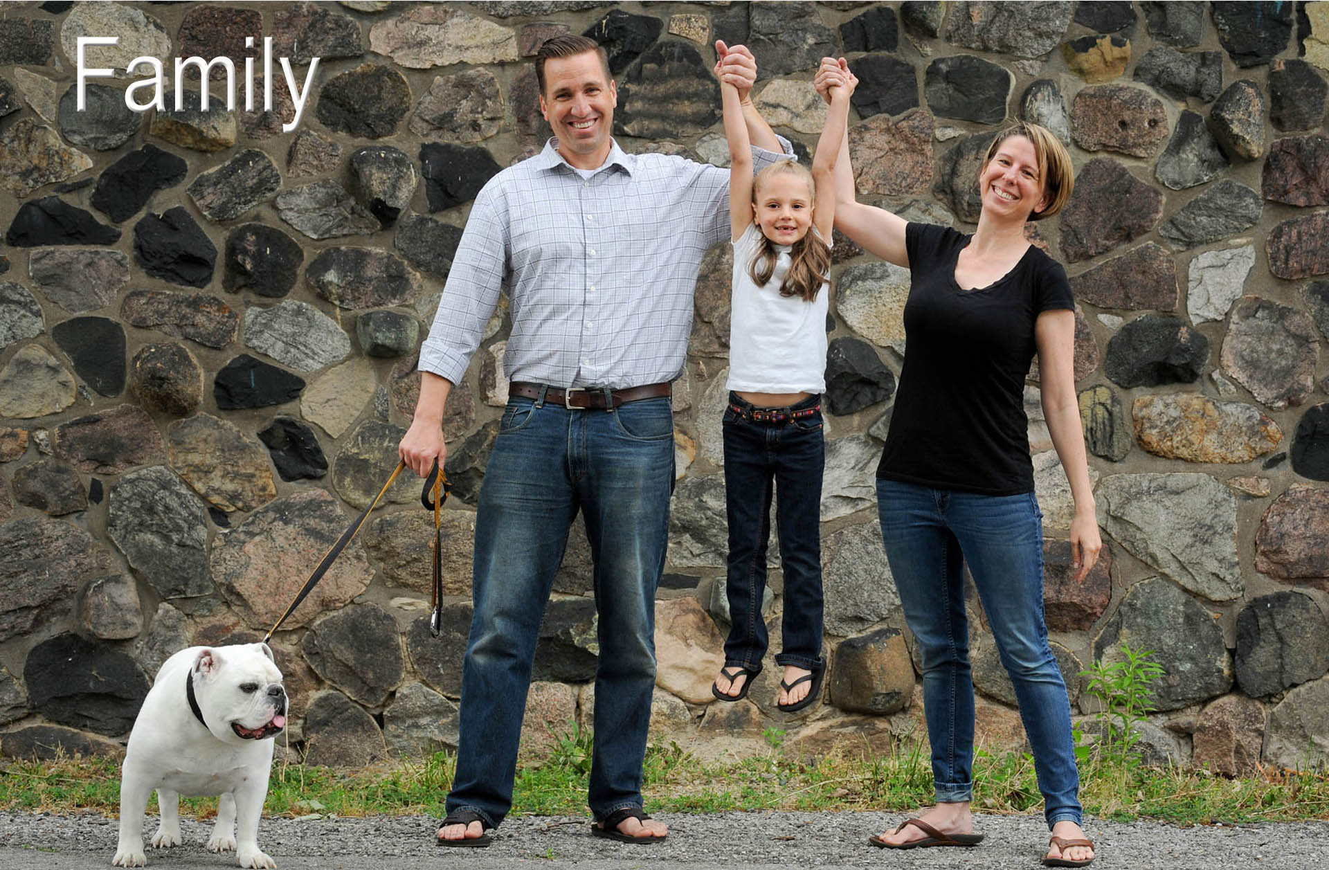A metro Detroit area couple celebrate the arrival of their adopted daughter with a fun, happy family photo downtown Detroit, Michigan.