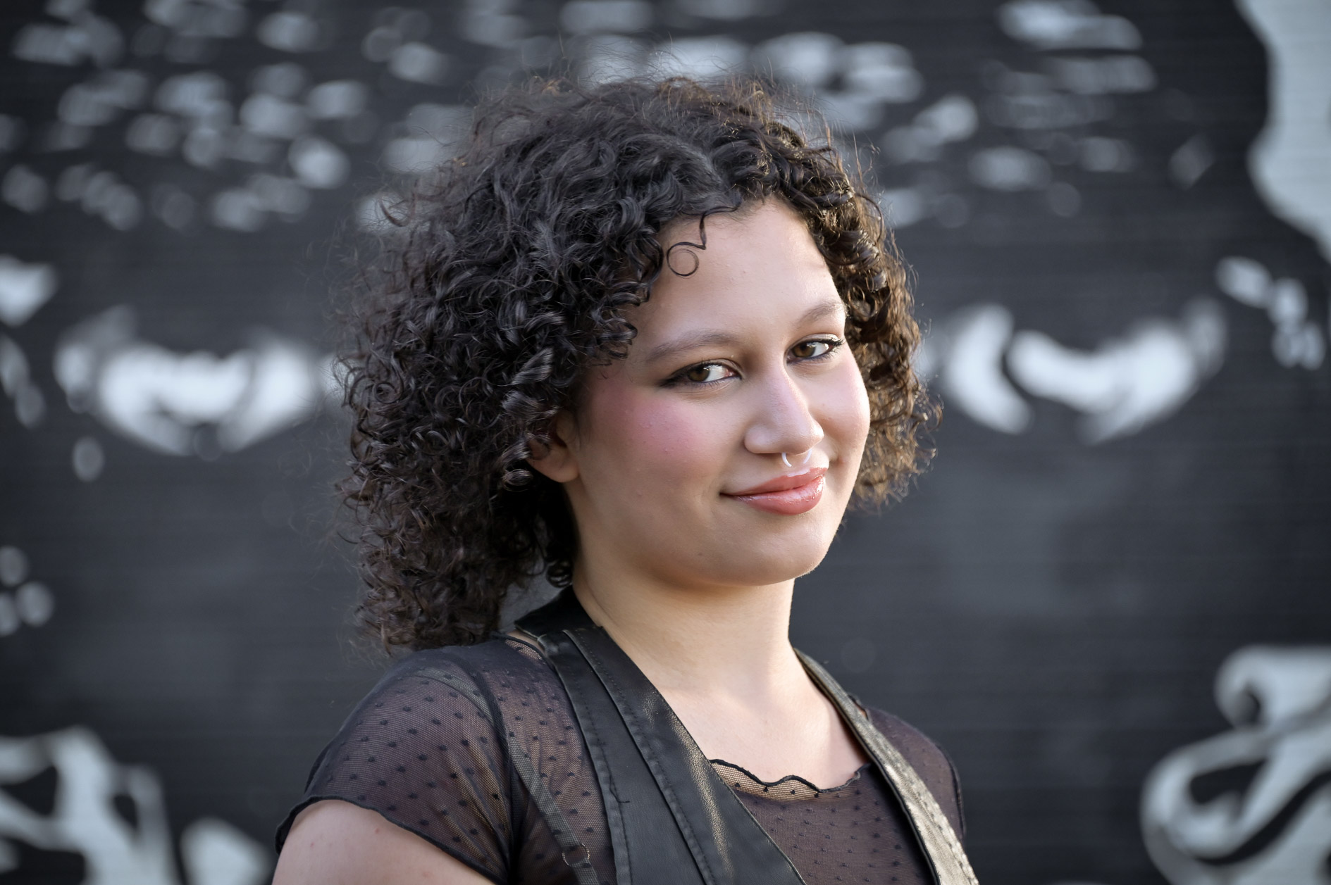 Birmingham Groves High school senior with a black and white wall mural in Detroit, Mich.
