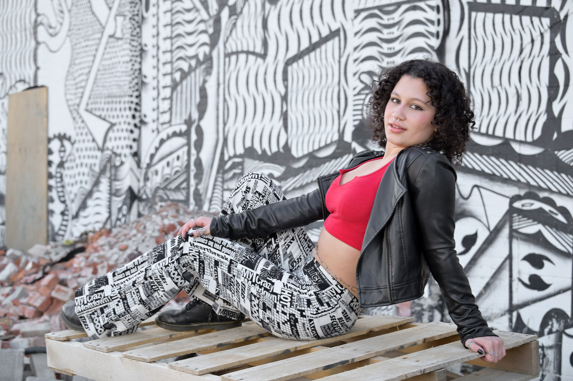 Birmingham senior makes herself comfortable on a pile of rubble on the always changing landscape of Detroit, MI. 