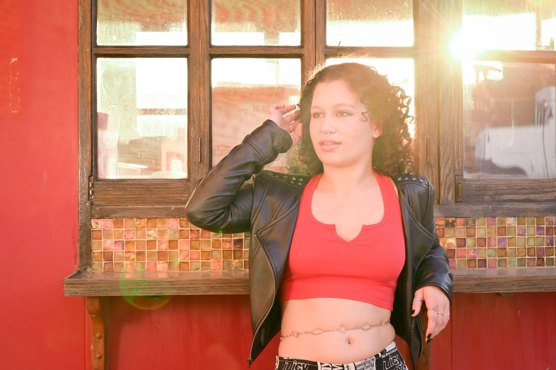 Birmingham, MI senior poses for this mature photo with sun flares.
