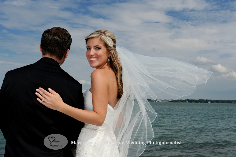 Grosse Ile, Michigan wedding photos of the bride along the river.