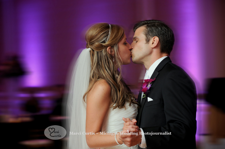 Wedding photography of a Michigan bride and groom sharing their first dance in Dearborn, Michigan at their wedding reception at The Henry.