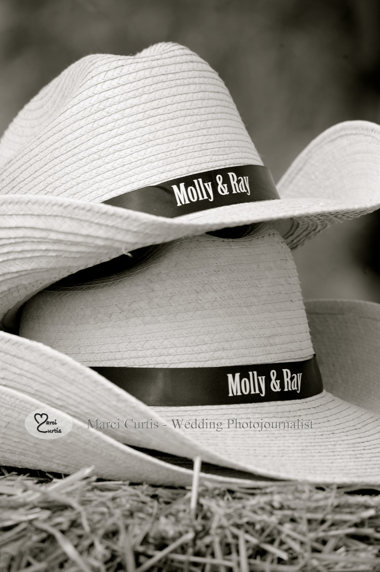 Wedding favors at this Michigan country wedding include personalized cowboy hats.