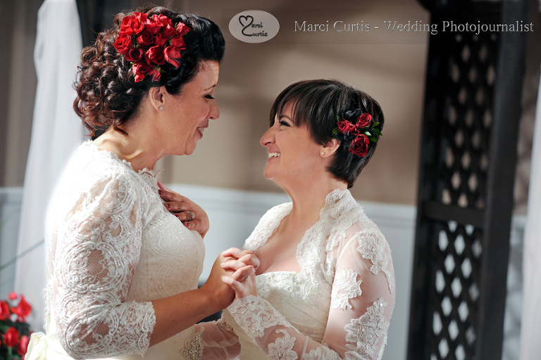 Jenn and Emily share their first dance as wife and wife during their wedding reception in Livonia, Michigan on historic June 26th, 2015. Photo by Marci Curtis - Michigan Wedding Photojournalist.