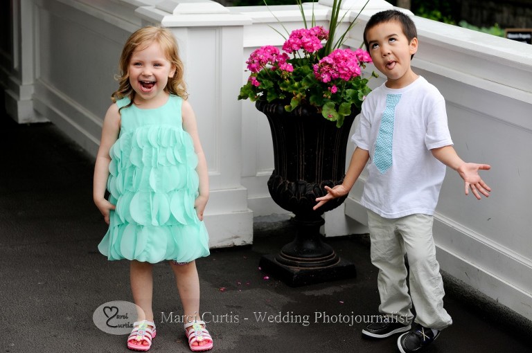 Two little relatives of the bride and groom at the Wellers Raisin River room in Saline, Michigan goof off during the wedding reception during the five minutes it wasn't raining that day.