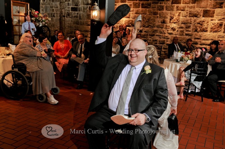 Dale's turn during the Dating Game during their Wellers Raisin Room wedding reception in Saline, Michigan.
