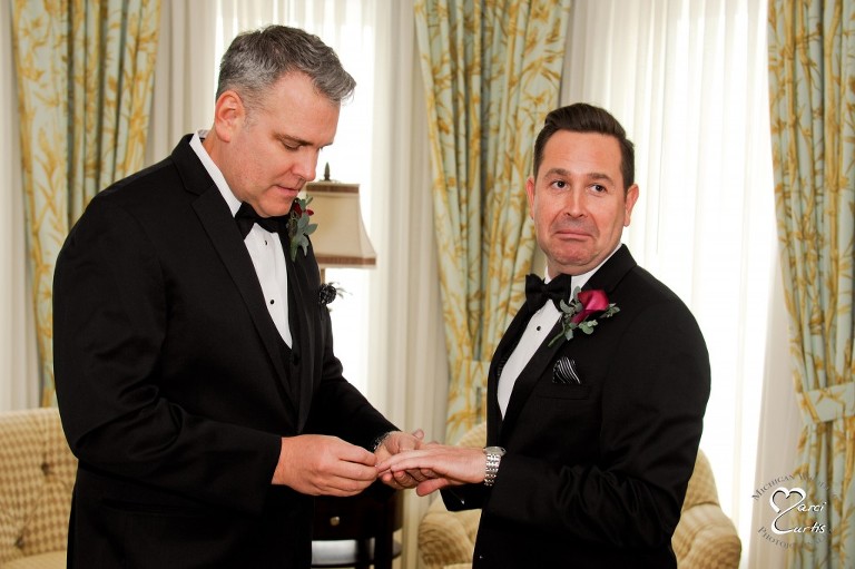 Kevin makes an awesome face just as his partner slides his wedding ring on at the Royal Park Hotel in Rochester, Michigan.