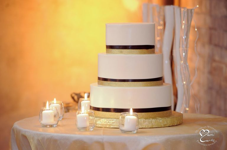 Wedding cake with yellow uplighting at the Jam Handy in Detroit, Michigan.