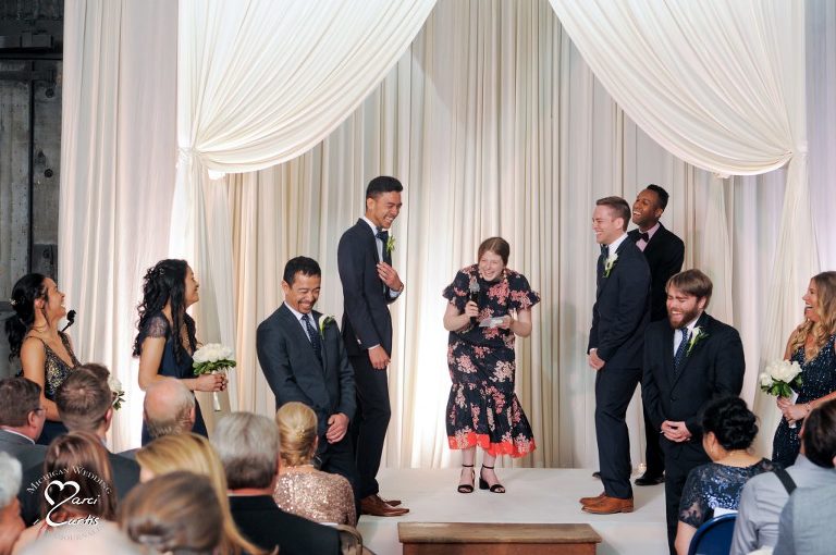 Laughter during the wedding ceremony at the Jam Handy in Detroit, Michigan.