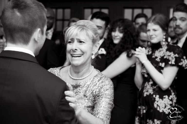 Mother of the groom cries during her dance with her son at Jam Handy.