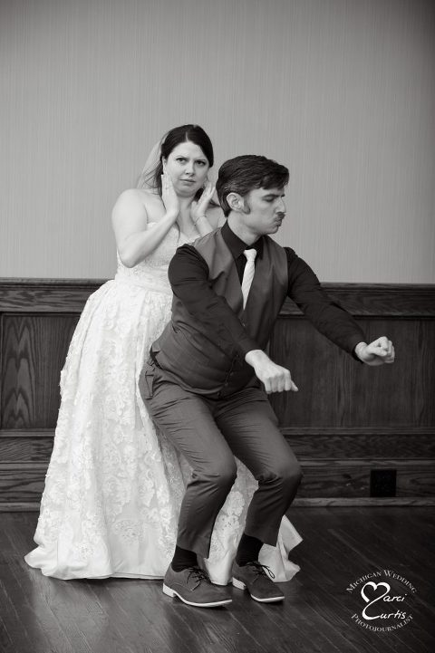 The bride and groom enjoy a very non traditional first dance at the White Oaks Country Club Golf Course wedding in White Lake, Michigan.