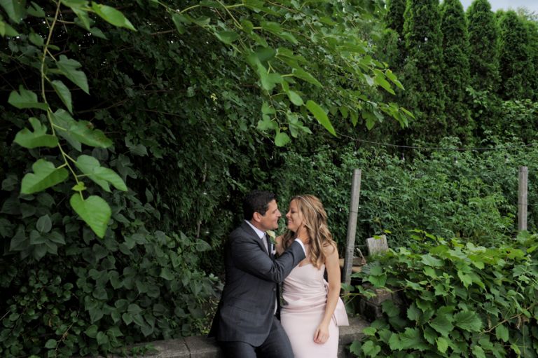 The bride and groom smooch shortly before their tiny second wedding at Cafe Cortina in Farmington Hills, Michigan.