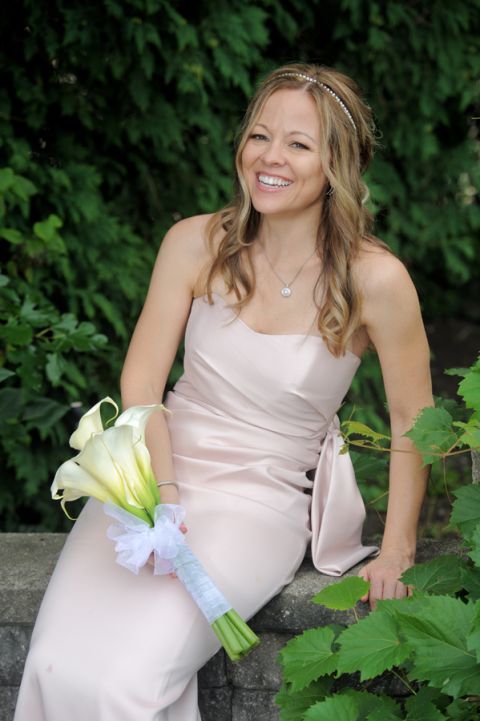 The bride and groom in the fresh garden before their tiny second wedding at Cafe Cortina in Farmington Hills, Michigan.