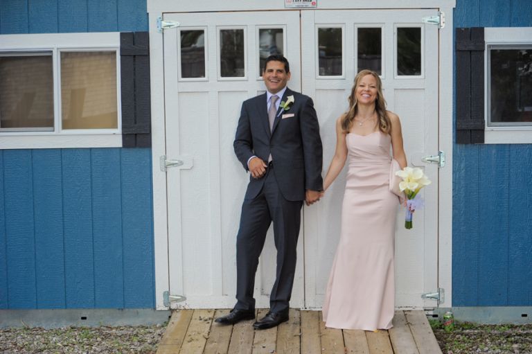 The bride and groom in the fresh garden before their tiny second wedding at Cafe Cortina in Farmington Hills, Michigan.