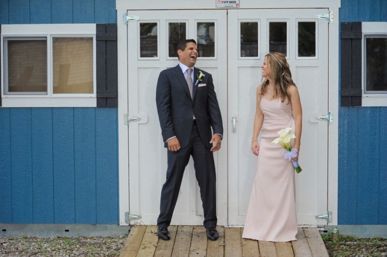 The bride and groom goof off just before their tiny second wedding at Cafe Cortina in Farmington Hills, Michigan.
