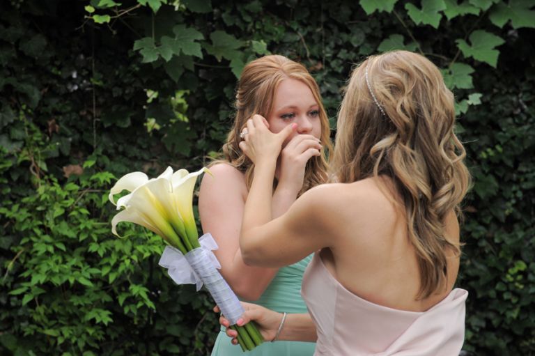 The bride comforts her daughter after her tiny second wedding at Cafe Cortina in Farmington Hills, Michigan.