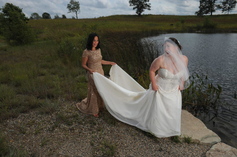 The wind was a big issue before this Indian Springs Metropark wedding in White Lake, Michigan playing havoc with the bride's veil.