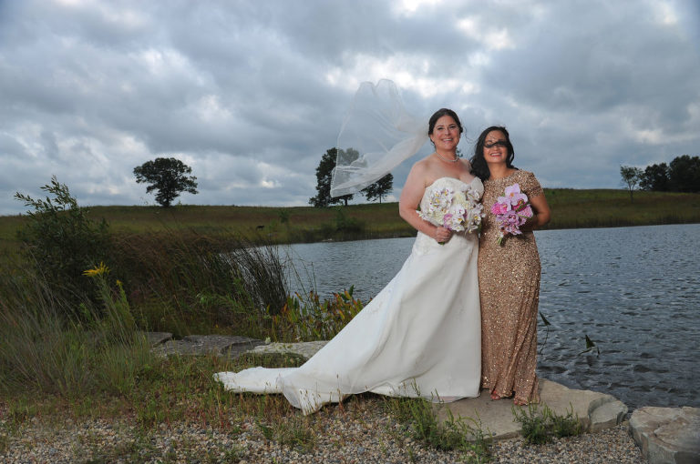 The wind was a big issue before this Indian Springs Metropark wedding in White Lake, Michigan playing havoc with the bride's veil and the matron of honor's hair.
