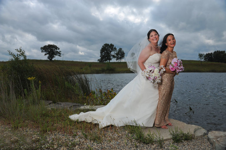 The wind was a big issue before this Indian Springs Metropark wedding in White Lake, Michigan playing havoc with the bride's veil and the matron of honor's hair.