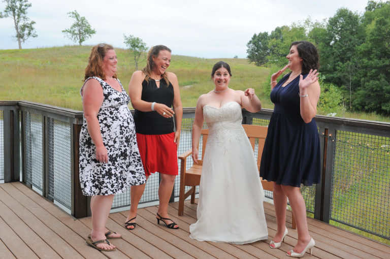 The bride share a laugh after her wedding at the Indian Springs Metropark in White Lake, Michigan.