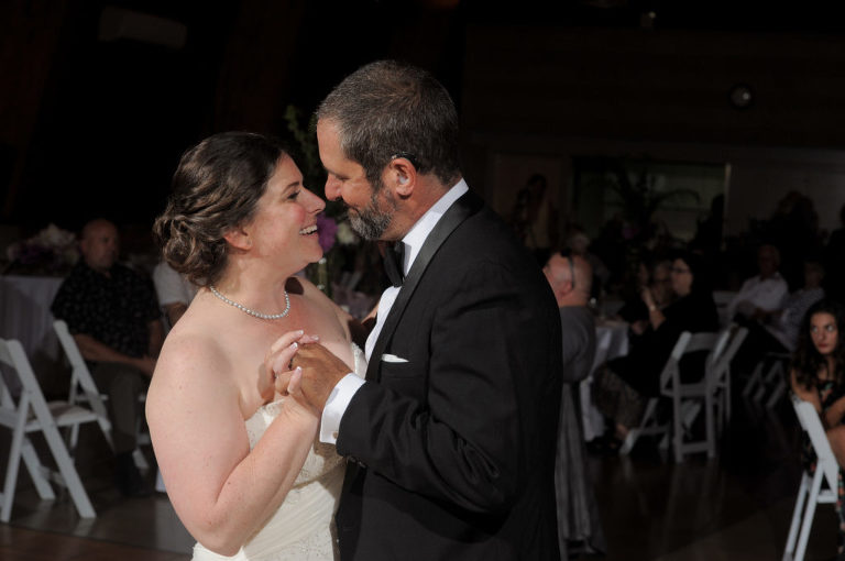 The bride and groom share a first dance at the Environmental Discover Center at the Indian Springs Metropark in White Lake, Michigan.