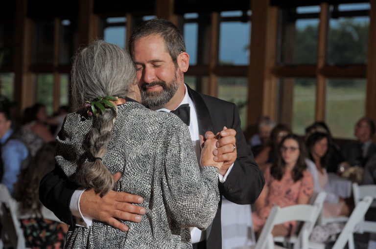 The groom and his mother share a first dance at the Environmental Discover Center at the Indian Springs Metropark in White Lake, Michigan.