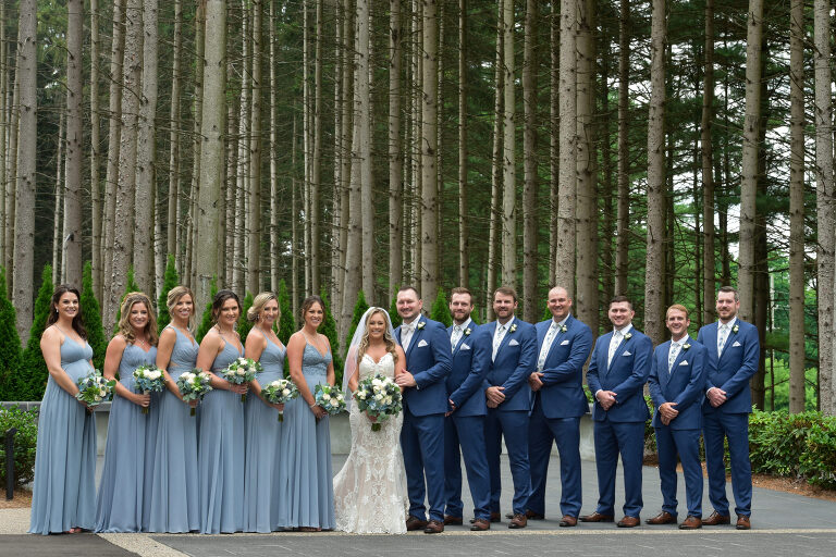 Using the dramatic lodge pole pines as a backdrop for wedding photos was a no brainer at Shepherd's Hollow's new wedding venue in Clarkston, Michigan, which even worked with this fairly large wedding party.