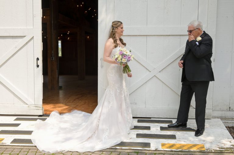 The bride had a first look with her father hoping to soothe both their emotions before her wedding at The Wyndgate in Rochester Hills, Michigan.