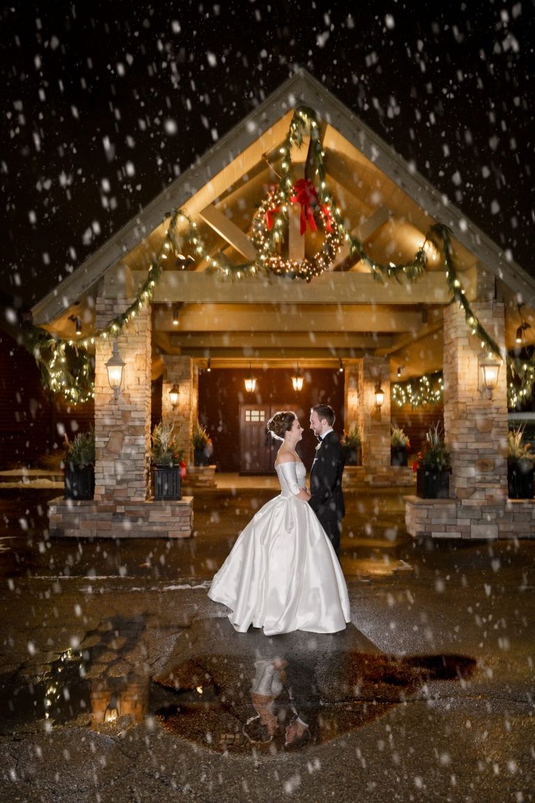Winter wedding couple pop outside for some quick snow weddings at the Iroquois Club in Bloomfield, Michigan.