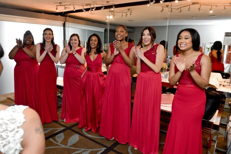 First look with brides at Roostertail Detroit wedding venue.