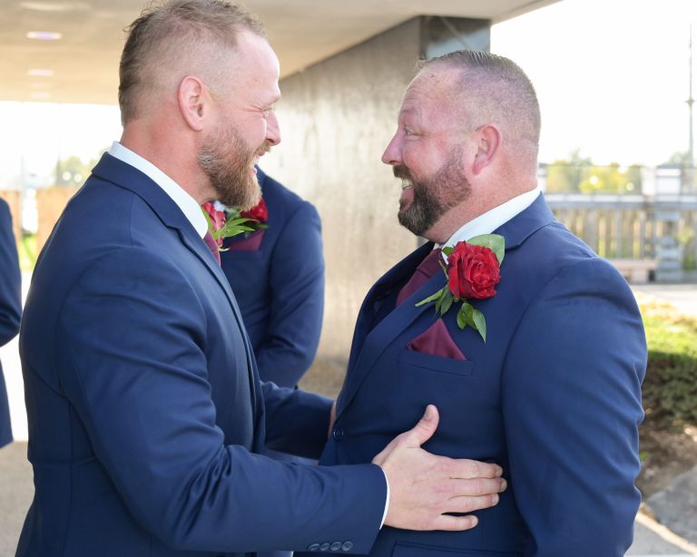 The best man gives the groom a pep talk just before heading down the aisle at the Roostertail wedding venue.