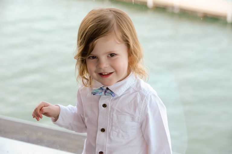 A small wedding guests waits by the window wall before the wedding gets started.