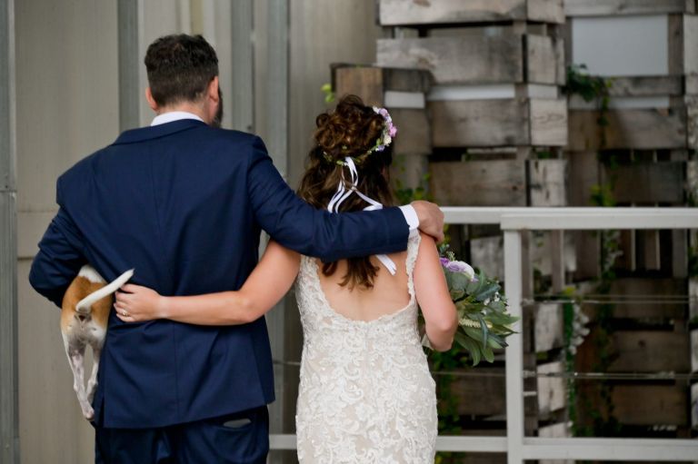 The dog's tail was wagging as the couple exited their wedding ceremony site at Roostertail. So cute!