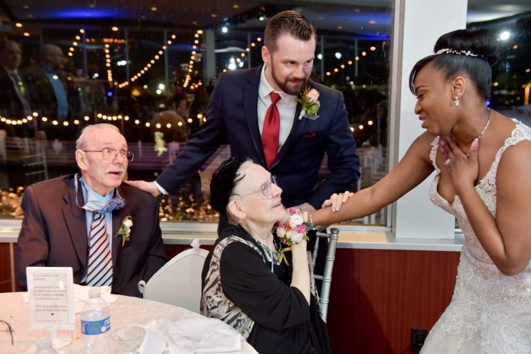 The couple checks in with grandparents at Roostertail in Detroit, Michigan.