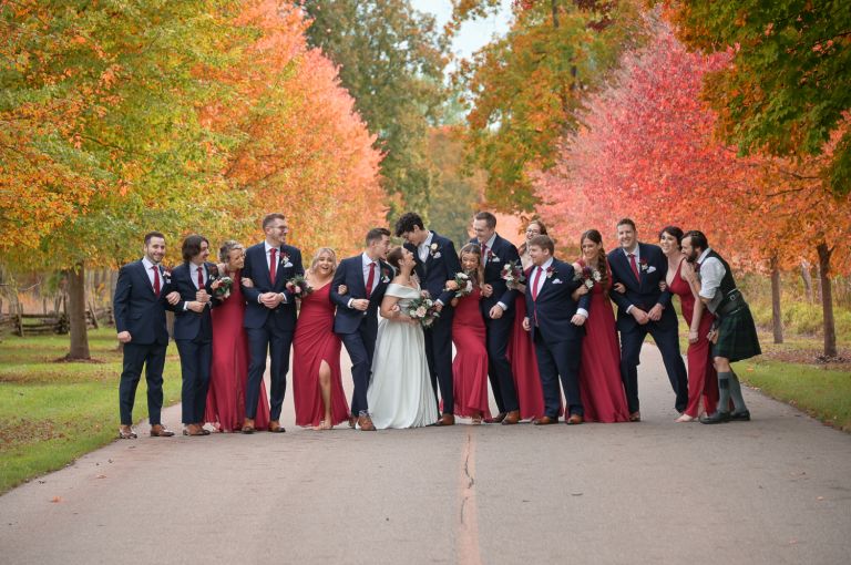 Wedding party during fall wedding at Addison Oaks Buhl Estates in Leonard, Michigan.
