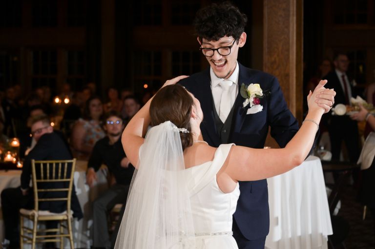 The bride and groom enjoying their first dance at their wedding at Addison Oaks Buhl Estates in Leonard, Michigan.
