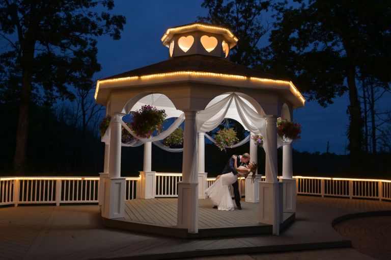 The bride and groom on the grounds of Twin Lakes Golf Course for their fun wedding.