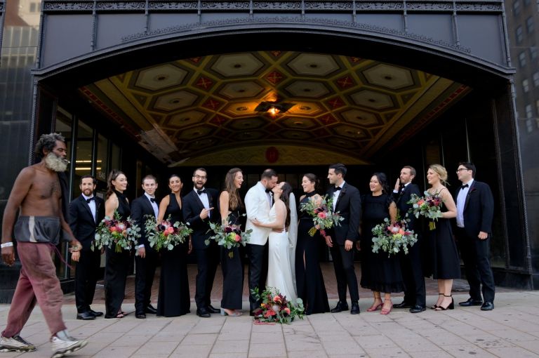 The wedding party with a classic pose on the streets of Detroit near the Shinola Hotel.