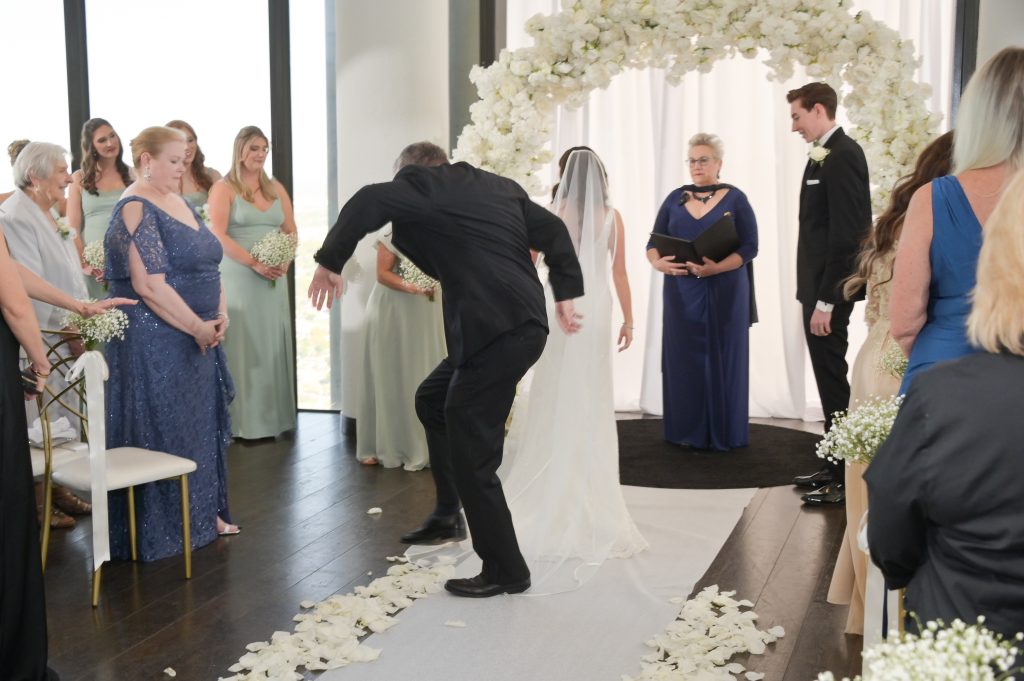 The father of the groom trips on the bride's veil after walking her down the aisle. This happens ALL the time!