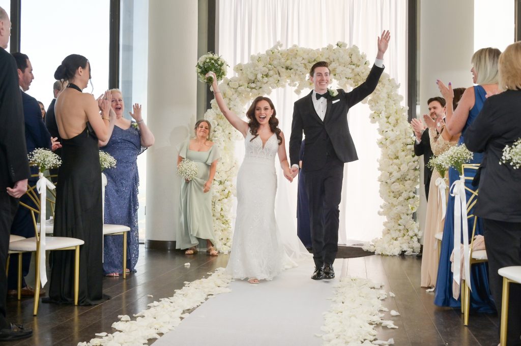 The groom's sister officiates the wedding at Highlands Detroit.