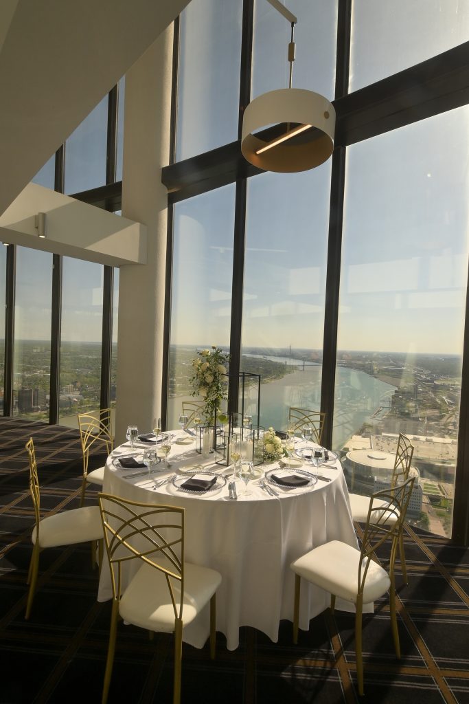 Detroit skyline visible through the windows at Highlands Detroit.
