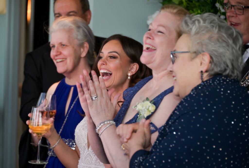 bride and family enjoying themselves at the cocktail hour.