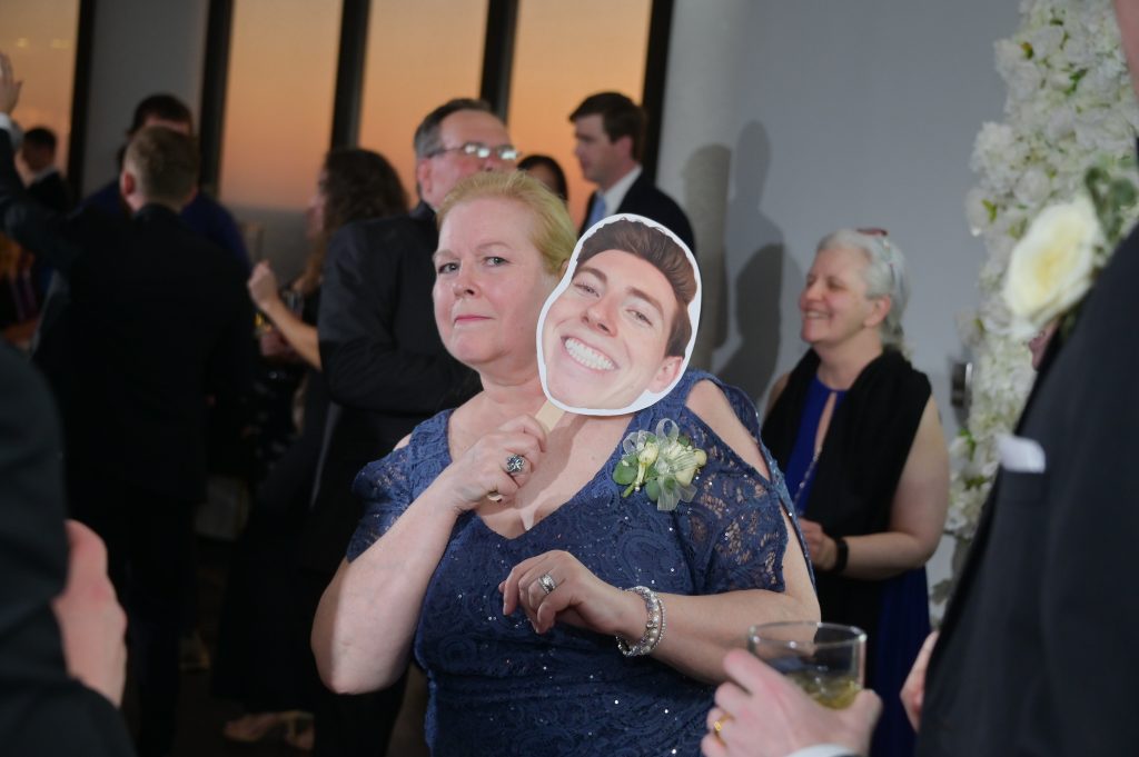 Mom with a "Big Head" of her son during open dance at Highlands Detroit.