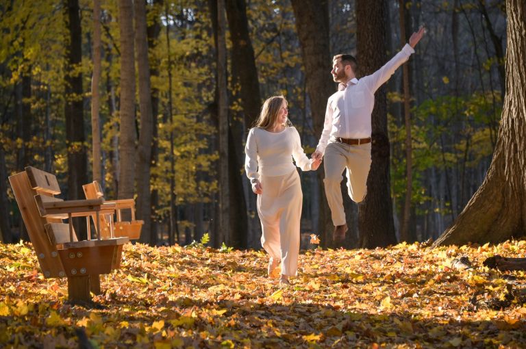 Having some fun in the fall leaves in Troy, Michigan with this newly engaged couple.