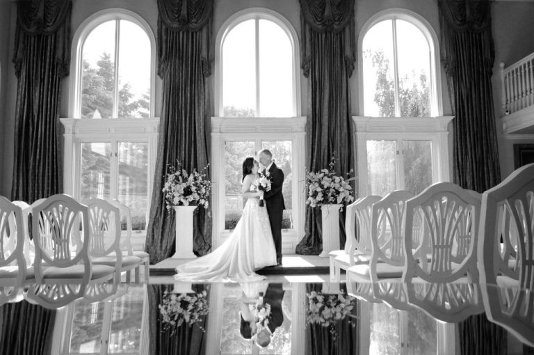 An older wedding couple posing at the White House Wedding Chapel in Warren, Michigan.