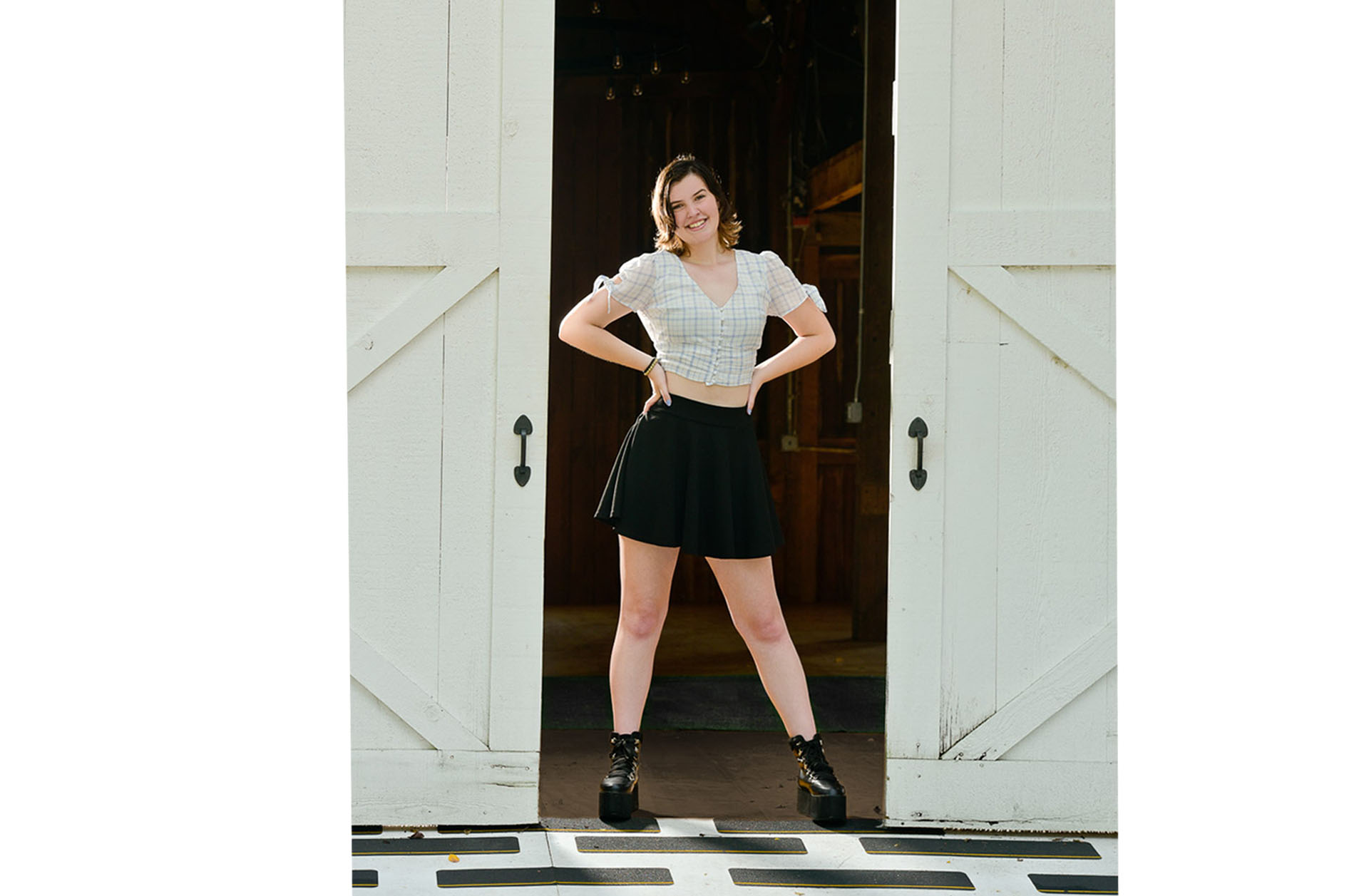 Carter standing in the doorway of a barn at The Wyndgate Country Club in Rochester Hills, Michigan.
