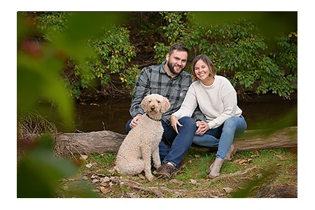 A couple and their dog during an engagement photography session in Rochester, MI