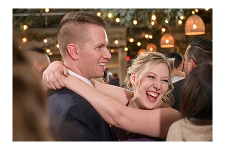 Detroit wedding photography candid moment at Blake's Orchard wedding reception.